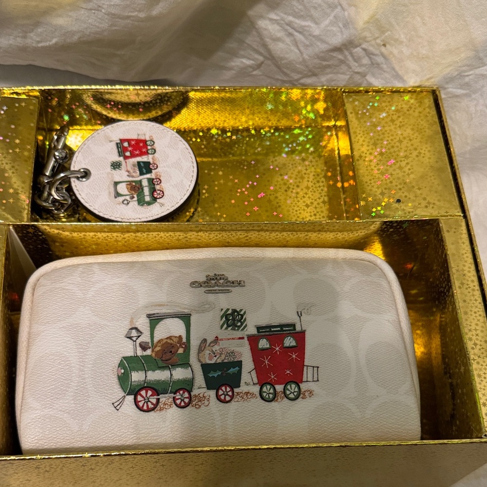 Coach White cosmetic bag and Keychain Set with Train Design